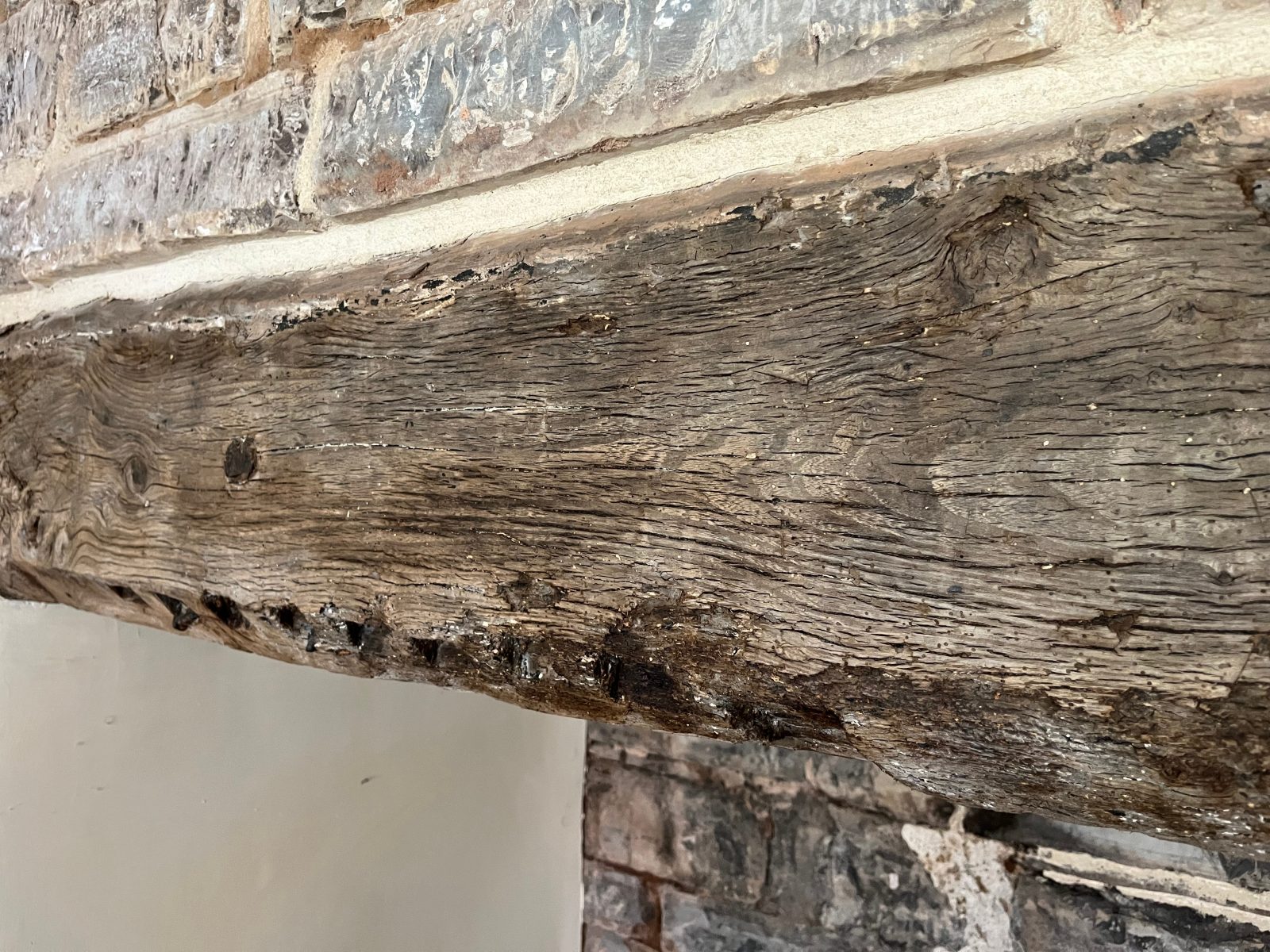 Bressumer with witch mark – Tudor Holiday House